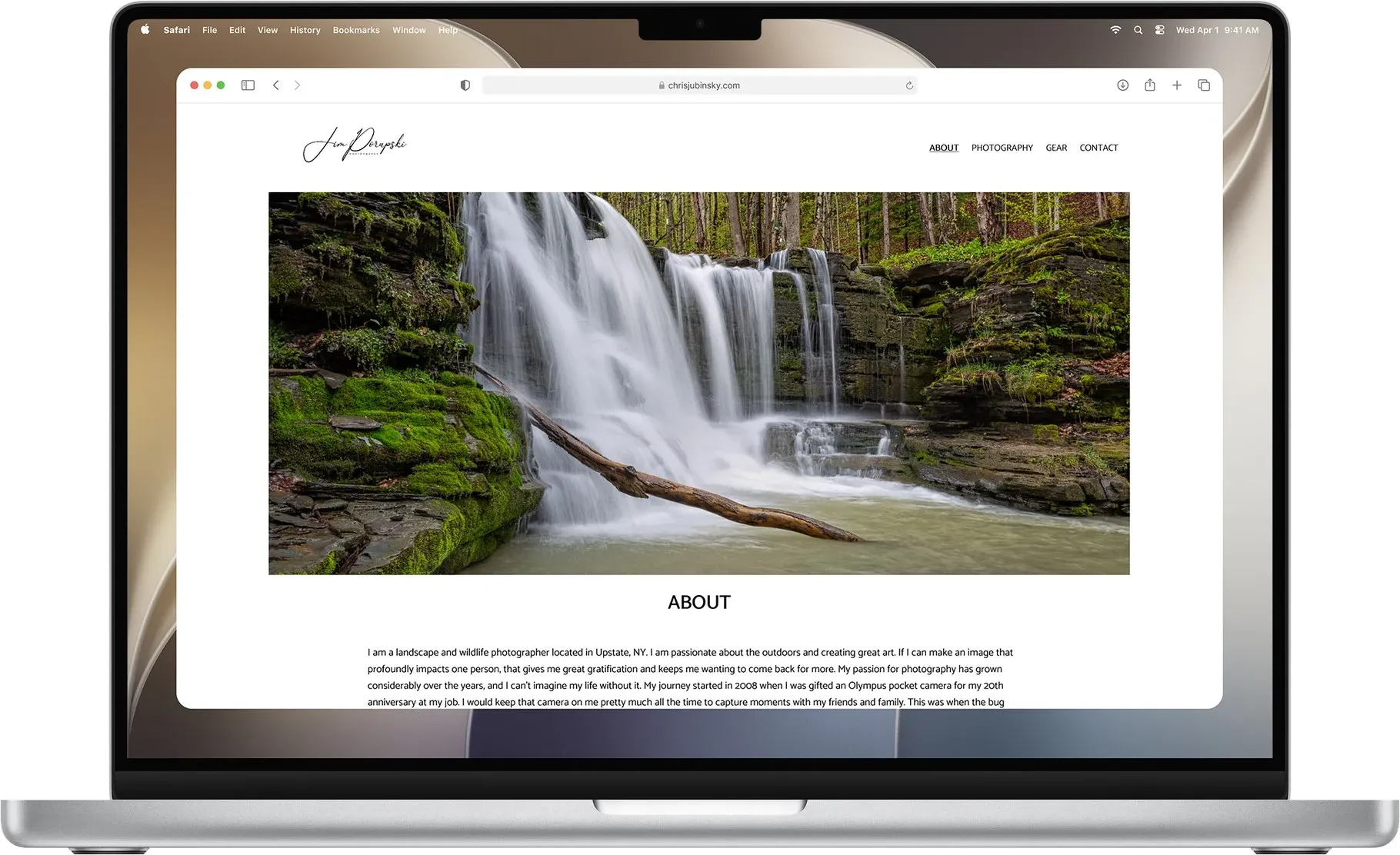 The About page at the desktop breakpoint on a laptop, with the waterfall hero and full nav