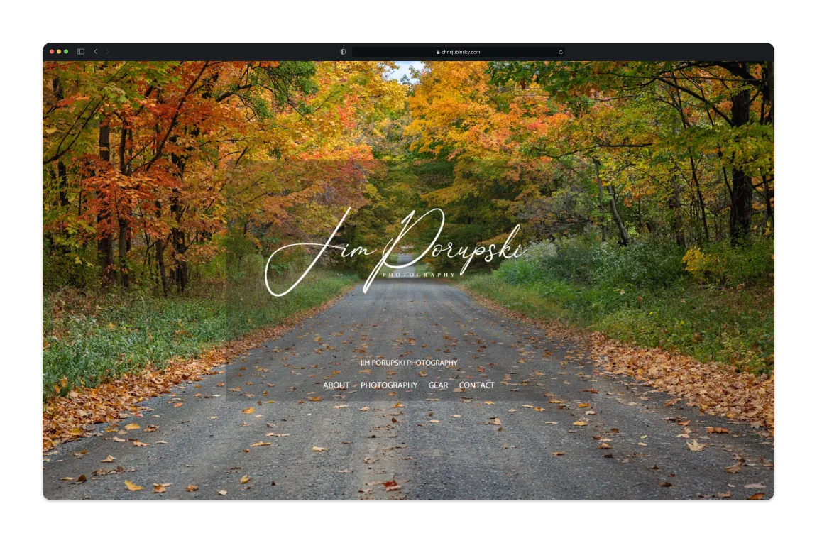 The photography site's homepage in a Safari window, an autumn road photograph behind the studio name and nav