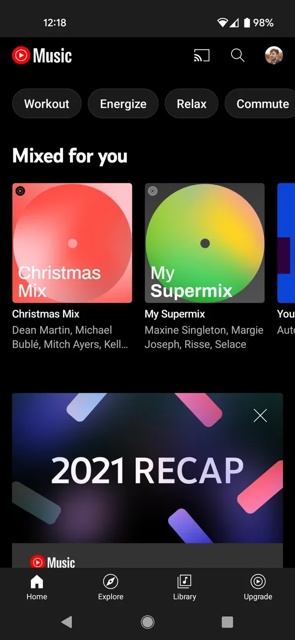 YouTube Music home screen on Android with mood chips, Mixed for you, and a 2021 Recap card